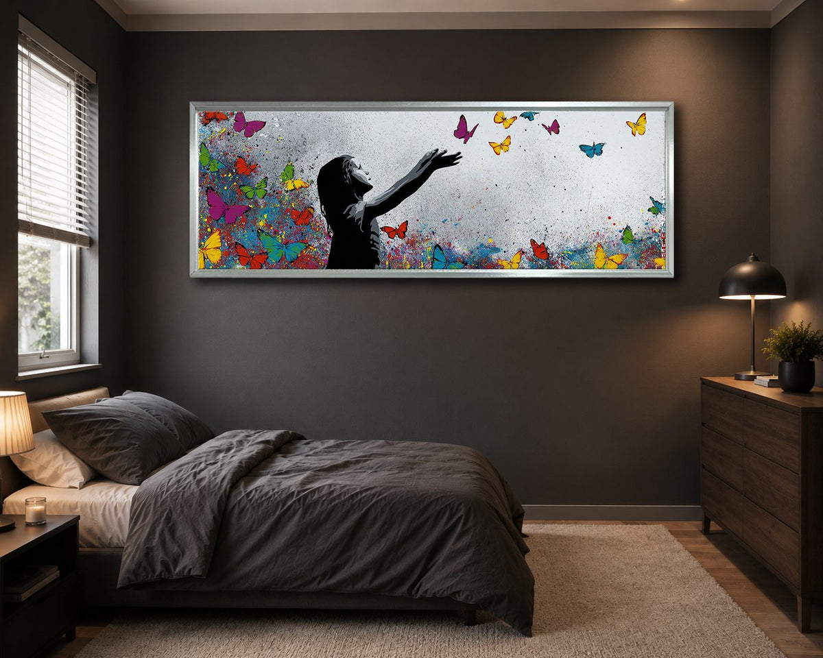 Girl Releasing Colorful Butterflies canvas wall art, silver floating frame